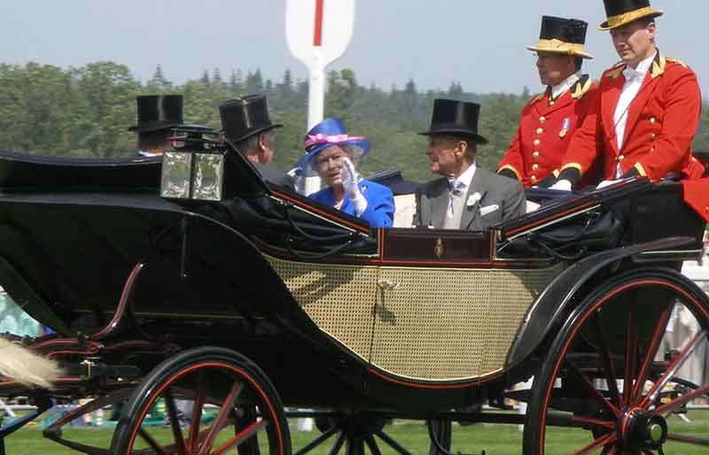 The Queen and late husband at in a horse-drawn carriage.