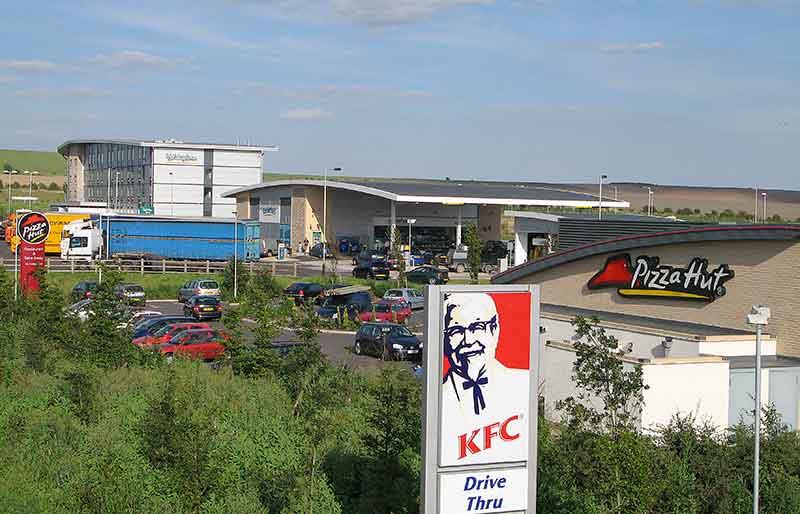 Pizza Hut, the petrol station and Holiday Inn hotel with KFC sign in foreground.